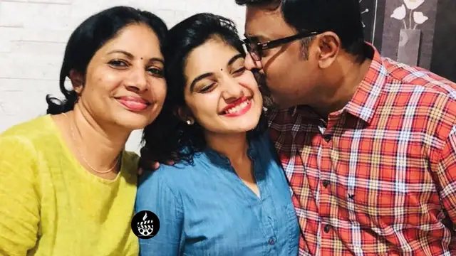 Nivetham Thomas with Her Mom and Dad